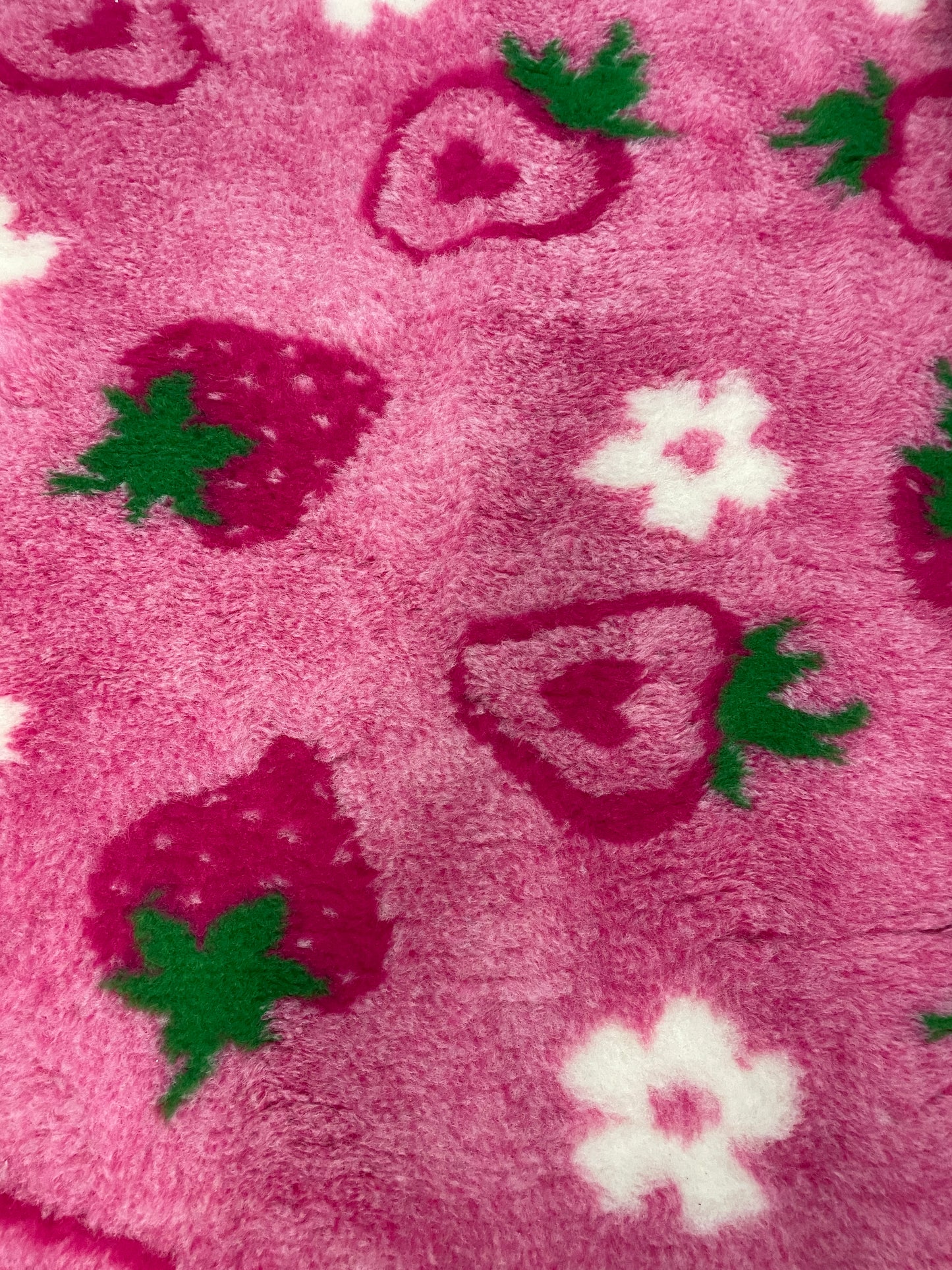 Pink strawberry design vet bedding for dogs close up