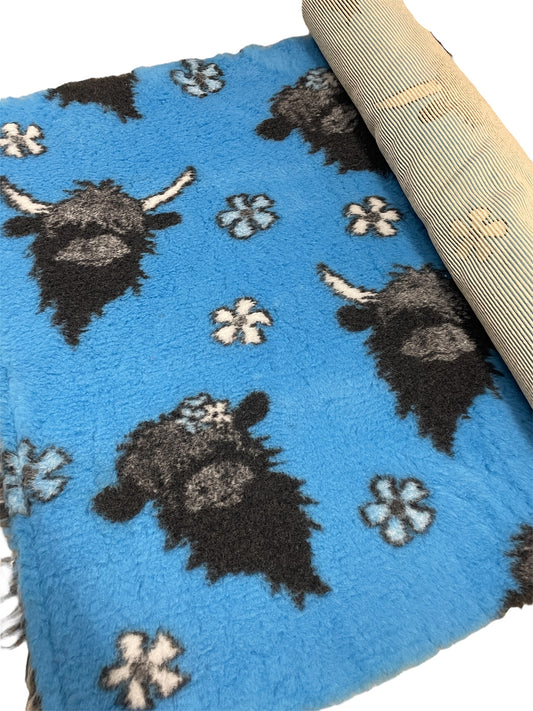 Blue vet bedding roll with Highland cow design for dogs and small pets