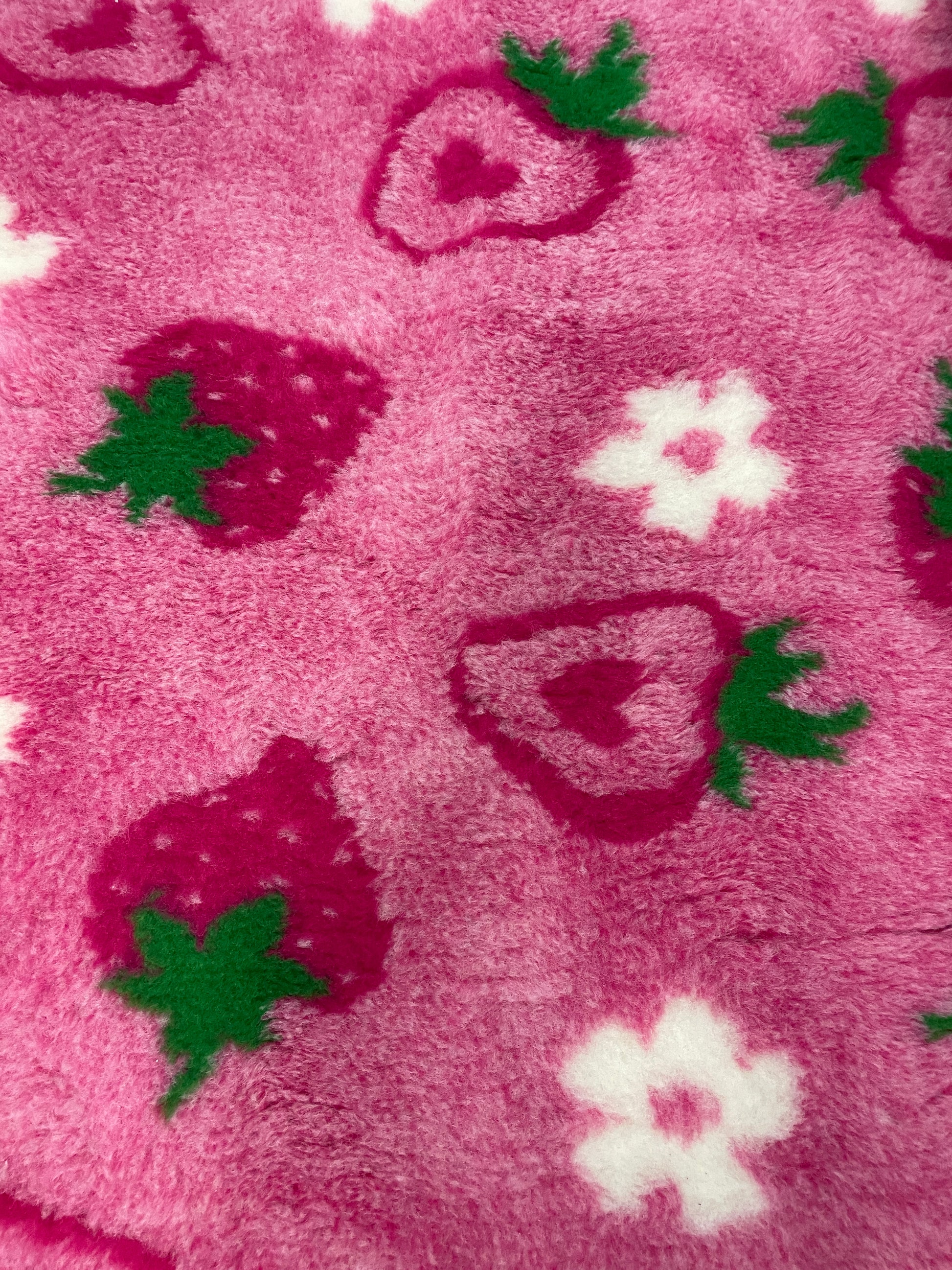 Pink strawberry design vet bedding for dogs close up